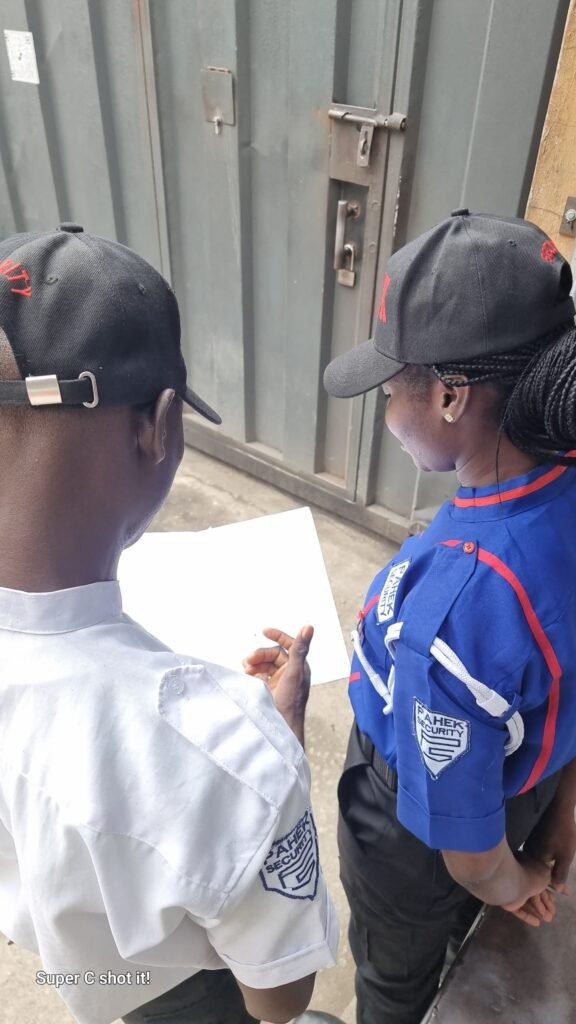 Supervisor reviewing guard documentation on-site.